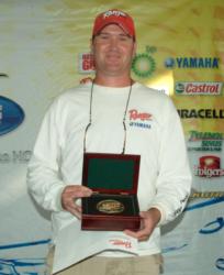 Co-angler Matt Rigby holds up his trophy for winning the 2007 TTT Championship on Sam Rayburn.