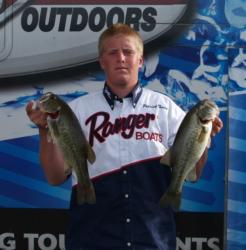 Co-angler Patrick Touey holds up the first five-bass limit of his young career.