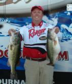 Seventh-place pro Thomas Redington holds up his two biggest bass from day one on Falcon Lake.