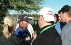 Pro leader Brett Hite speaks with a throng of reporters at the day-one weigh-in.