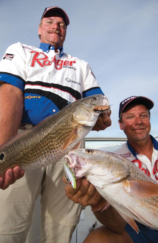 Broward, Florida bass fishermen Billy Bob Crosno, left, and Anthony Hunt  hold up an estimated two-pound bass that Hunt caught using a new  spinnerbait. Hunt eventually caught a much larger fish on