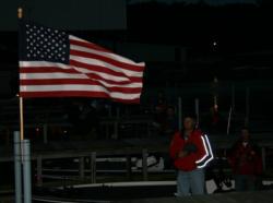 A steady wind kept the American flag flying high during the playing of the national anthem.