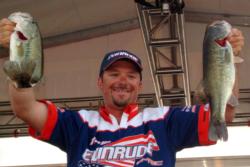 Roy Hawk of Salt Lake City, Utah, shows off his first-place stringer after winning the FLW Series event on Lake Mead.