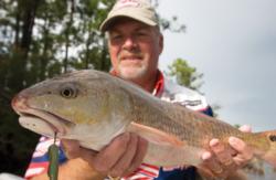 FLW Redfish Series pro Ray Van Horn catches a red on a drop-shot rig.