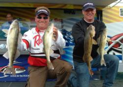 Pro Scott Steil and co-angler Jerry Chwierut hold up their day-three catch from Cass Lake.