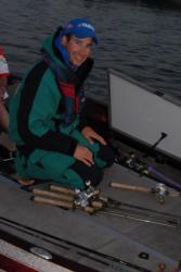 Local pro Ott Defoe of Knoxville removes a bevy of rods from his rod locker before takeoff.