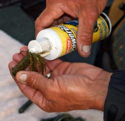 Charlie Hartley of Columbus, Ohio adds Berkley scent enhancer to the tube jigs he