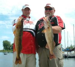 Pro Pete Harsh and co-angler Michael Tesmer hold up their two overs Thursday.