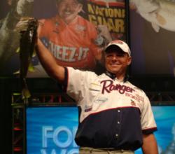 Pro Mathew Saavedra holds up his 6-pound, 6-ounce kicker bass from Friday