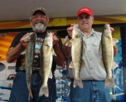 Boater Galen Bremmer and co-angler Tom Laveque hold up their 20-pound, 5-ounce catch from day three. 
