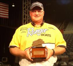Co-angler David Anderson shows off his trophy for winning the 2008 FLW Walleye Tour Championship on the Missouri River.