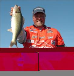 Championship winner Tommy Skarlis holds up his kicker walleye from day four on the Missouri River.
