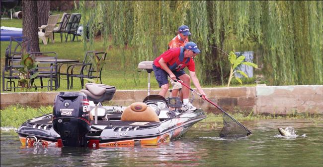 Bass pro Michael Bennett lands one in the Forrest Wood Cup as his co-angler mans the net.