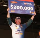 Tums pro David Fritts holds up his check for winning the Chevy Open on Lake Guntersville.