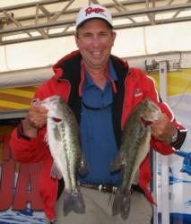 Co-angler leader David Hudson holds up two nice Lake Norman largemouths.