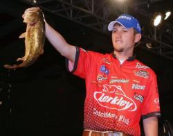 Second-place pro Stetson Blaylock holds up his kicker bass from day four on Lake Norman.