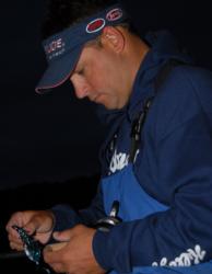 Local pro Greg Bohannan readies a flipping bait for the start of the Walmart Open.
