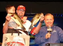 Boater Allan Cagle, holding his 6-year-old son, Colbie, is in fifth after day one with 10-10.