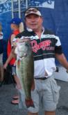 Mike Reid holds up a 7-pound, 15-ounce largemouth bass. The fish won Reid the Folgers Big Bass in the Co-angler Division and $500.