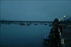 Anglers lined up along a pier in the pre-dawn darkness before the start of the tournament.