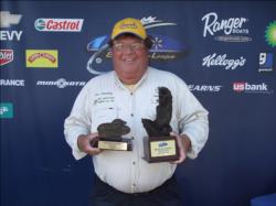 Co-angler William Schwartz of Avon Lake, Ohio, proudly displays his first-place trophy after winning the BFL Michigan Division event on the Detroit River. Schwartz also took home big bass honors after netting a 6-pound, 1-ounce largemouth.