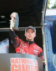SUNY Plattsburgh angler Mitchell Davis holds up his kicker bass from day one on Lake Norman. 
