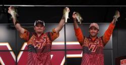 Virginia Tech anglers Scott Wiley and Charlie Machek hold up a four-bass stringer Monday that weighed 7 pounds, 6 ounces. Wiley and Machek finished the tournament in second place.