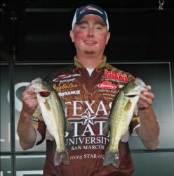 David Cosner of fifth place Texas State University shows off a pair of Sibley Lake bass.