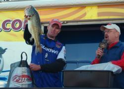 Keith Combs holds up his smallest bass from day three on Falcon Lake.