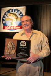 FLW Outdoors Chairman Irwin L. Jacobs shows off his plaque after being inducted into the Bass Fishing Hall of Fame.