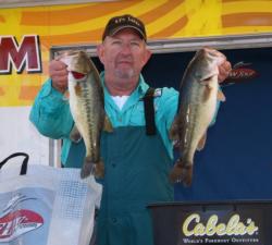 Second-place co-angler Darrell Mitchell holds up his two biggest bass from day one.