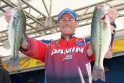 Third-place pro Bryan Thrift holds up his two biggest bass from day three.