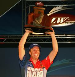 With trophy in hand, Brent Ehrler celebrates after winning the FLW Tour event on Table Rock Lake.