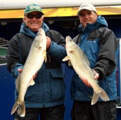 Pro John Campbell and co-angler Mirko Canji hold up their two biggest walleyes from Thursday