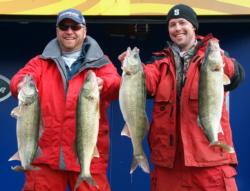 Pro Ed Stachowski and co-angler Rich Carmack hold up part of their day-two catch.