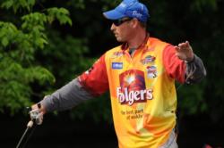 Bryan Thrift pitches a Spro frog under trees on day four.