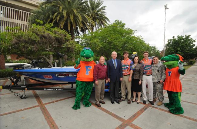 University of Florida mascots Albert and Alberta flank FLW Outdoors President and CEO Charlie Evans, University of Florida President Dr. Bernie Machen, University of Florida student Jake Gipson, University of Florida Vice President for Student Affairs Patricia Telles-Irvin, University of Florida student Matt Wercinski and Staff Sgt. Darrell Wilkes following the presentation of a special Ranger Z520 Comanche bass boat and matching Chevy Suburban to the students and a $50,000 donation to the university. The students earned the prize package by winning the 2010 National Guard FLW College Fishing National Championship. 