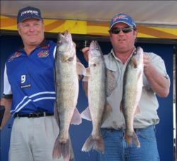 Pro Richard Lowe and co-angler William Drake hold up part of their 28-pound, 12-ounce day-three catch.