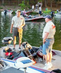 Boater Billy Bowen Jr. and co-angler Eric Filburn talk before takeoff on day two.