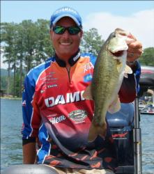 Bryan Thrift holds up one of the bass that helped him clinch Angler of the Year Friday.