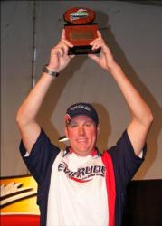 Co-angler champion Matt Hiller displays his trophy after winning the 2010 FLW Walleye Tour Championship.
