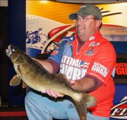 Second-place pro Terence Filkins holds up his 6-pound, 9-ounce kicker from day four on Leech Lake.