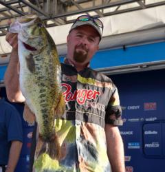 Third-place co-angler George Kapiton holds up his biggest bass from day two.
