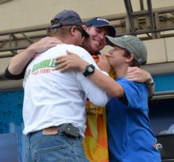 Pro winner Brandon McMillan celebrates with his father and brother after winning the 2011 FLW Tour opener on Lake Okeechobee.