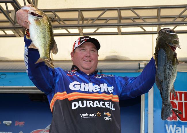 Fifth-place pro Jacob Powroznik holds up his two biggest bass from day four on Lake Okeechobee.