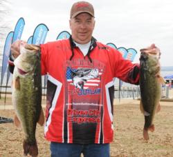 Steve Keller of Bethel, Ohio, leads the Co-angler Division of the EverStart event on Lake Guntersville with 24 pounds, 14 ounces, which included a 10-pounder.