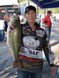 Fifth-place pro Kevin Hawk holds up his biggest bass from day one on Lake Chickamauga. 