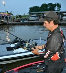Pro leader John Cox readies a couple rods before takeoff on the final day of the FLW Tour Major on the Red River.