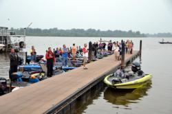 Anglers, media members and fans stand at attention for the national anthem at the Red River.