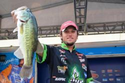 Stetson Blaylock of Benton, Ark., holds up part of his sixth-catch at the FLW Tour Potomac River event.